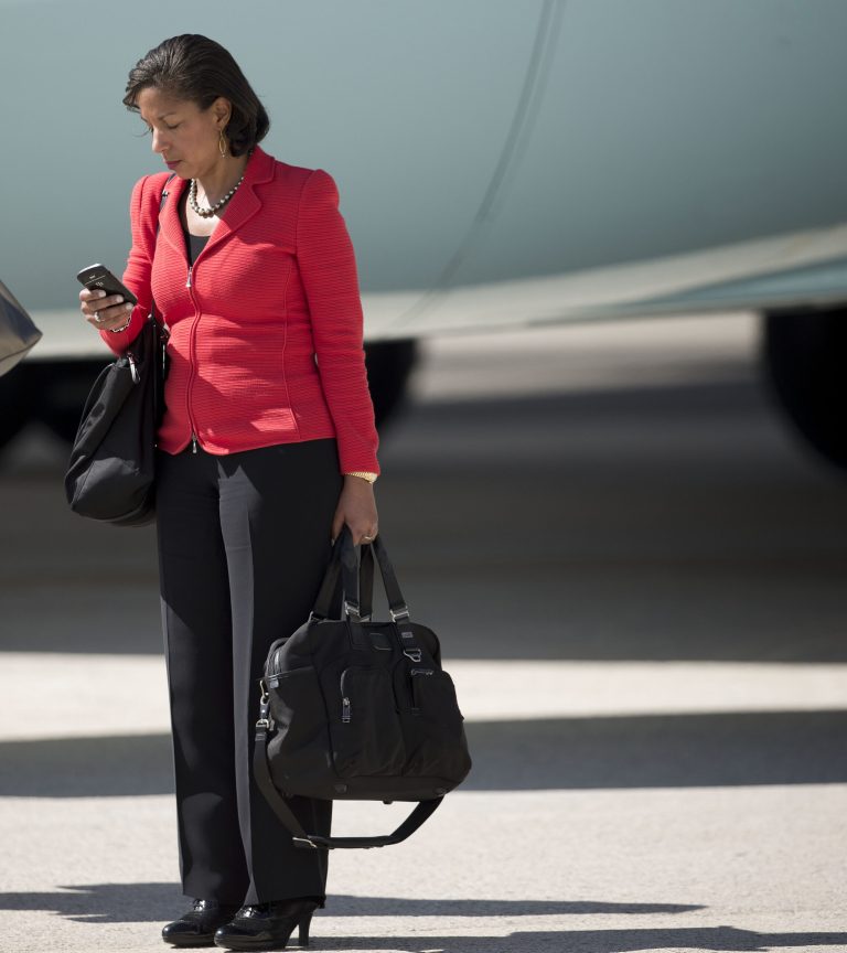 National Security Adviser Susan Rice checks her phone on the tarmac during President Barack Obama and first lady Michelle Obama's arrival on Air Force One at JFK International airport in New York, Tuesday, Sept. 23, 2014. Obama is traveling to New York for three days of talks with foreign leaders at the annual United Nations General Assembly. (AP Photo/Pablo Martinez Monsivais)