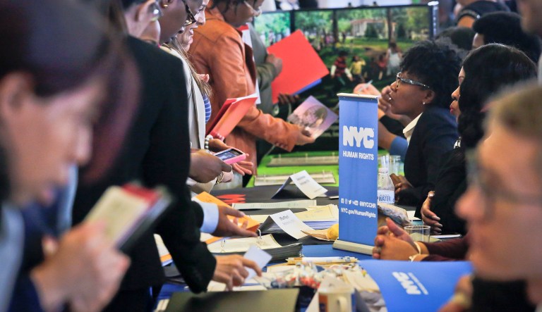 Job seekers attend a job fair in New York. Tuesday's report, based on the Job Openings and Labor Turnover Survey, includes figures about gross job creation, hiring, and layoffs that are not available in the monthly jobs report. (AP Photo/Bebeto Matthews)