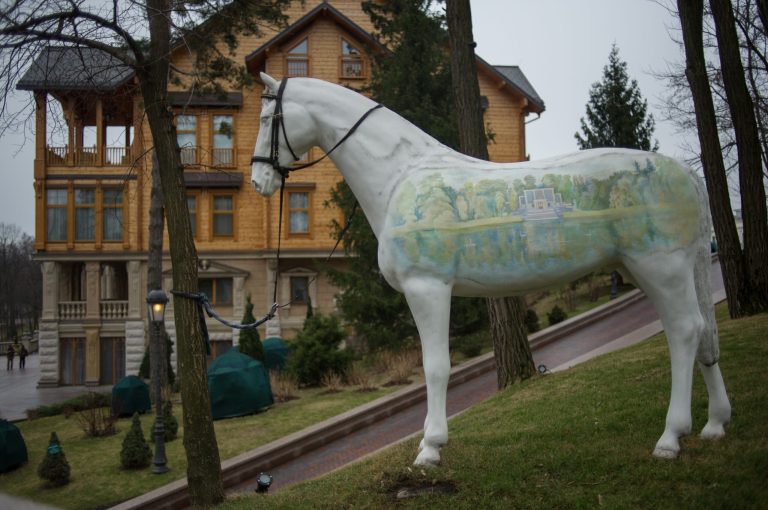 An ornamental horse stands outside  Ukrainian President Yanukovych's countryside residence in Mezhyhirya, Kiev's region, Ukraine, Saturday, Feb, 22, 2014. Ukrainian security and volunteers from among Independence Square protesters have joined forces to protect the presidential countryside retreat from vandalism and looting. Yanukovych left Kiev for his support base in the country's Russian-speaking east, but an aide said that he has no intention of abandoning power. (AP Photo/Andrew Lubimov)