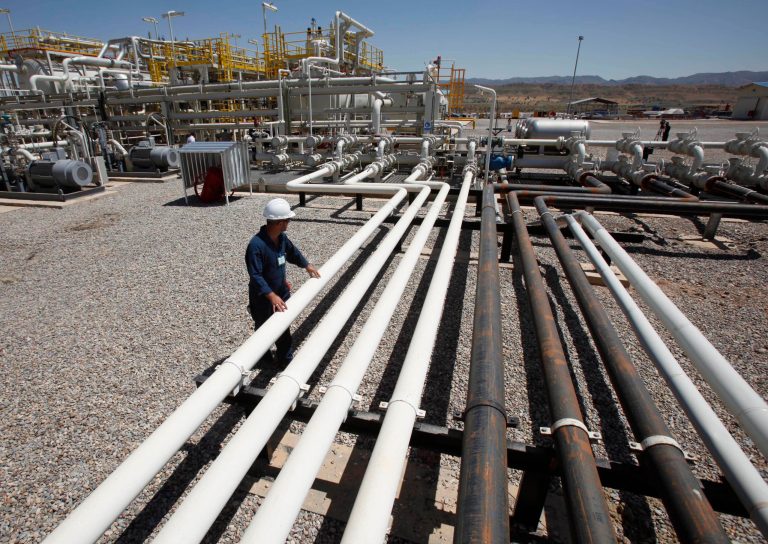 FILE - In this May 31, 2009 file photo, an employee works at the Tawke oil fields in the semiautonomous Kurdish region in northern Iraq. Iraq's self-ruled northern Kurdish region said Friday, May 23, 2014, that it has made its first oil shipment through its own pipeline to the international market, bypassing the central government in Baghdad, which insists that it has the sole right to develop and market the country's natural resources. (AP Photo/Hadi Mizban, File)