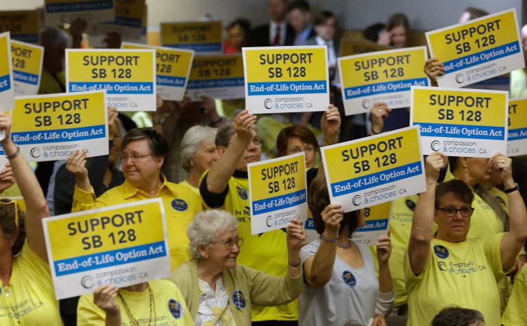 Supporters of proposed legislation allowing doctors to prescribe life ending medication to terminally ill patients, hold up signs of support during a hearing on the bill in the Senate Health Committee at the Capitol in Sacramento, Calif. Brittany Maynard, a 29-year-old San Francisco Bay Area woman who had terminal cancer, moved to Oregon where she could legally end her life. (AP Photo/Rich Pedroncelli)