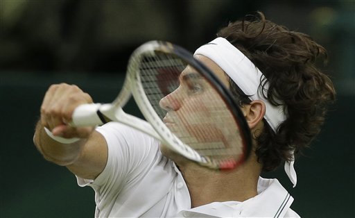Roger Federer of Switzerland plays a shot to Andy Murray of Britain during the men's singles final match at the All England Lawn Tennis Championships at Wimbledon, England, Sunday, July 8, 2012. (AP Photo/Anja Niedringhaus)