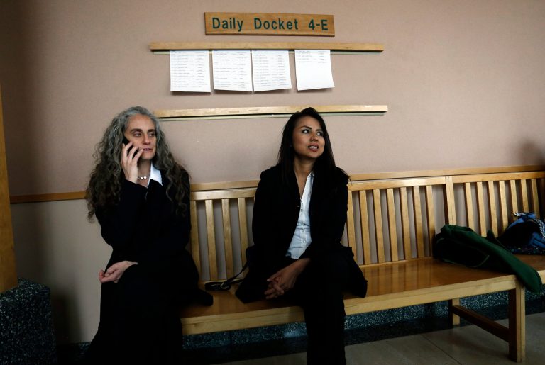 Sanctuary church resident Ingrid Encalada Latorre, right, sits with Jennifer Piper of the American Friends Service Committee outside a courtroom during a recess at the Jefferson County Courthouse in Golden, Colo., Wednesday, May 3, 2017. Latorre, an immigrant who has been living in a Denver church to avoid deportation, feared being arrested by federal immigration agents as she ventured out of her sanctuary to a court hearing Wednesday to try to stay in the United States. (AP Photo/Brennan Linsley)