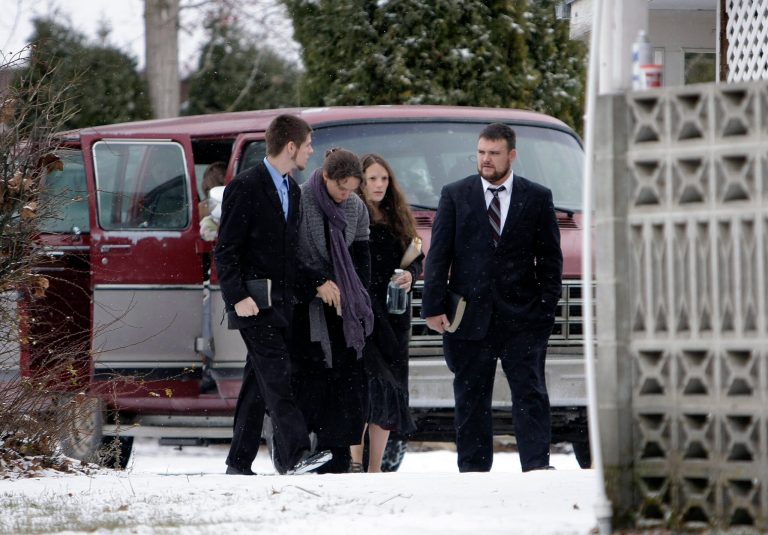   Family members of confessed serial killer Israel Keyes enter a funeral home, Sunday, Dec. 9, 2012, in Deer Park, Wash. Keyes confessed to killing eight people across the country before he committed suicide recently in a jail cell in Anchorage, Alaska. (AP Photo/Young Kwak)  
