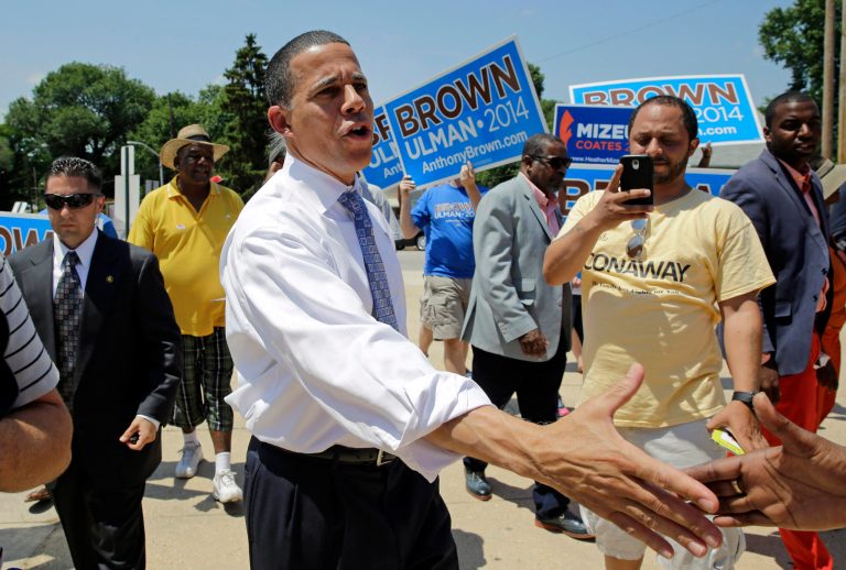Maryland Democratic gubernatorial candidate, Lt. Gov. Anthony Brown, shakes hands with supporters outside a polling place at Hazelwood Elementary/Middle School on primary day in Baltimore on Tuesday, June 24, 2014. Maryland Democrats and Republicans are heading to the polls Tuesday to choose nominees for governor in a closed primary in the heavily Democratic state. (AP Photo/Patrick Semansky)