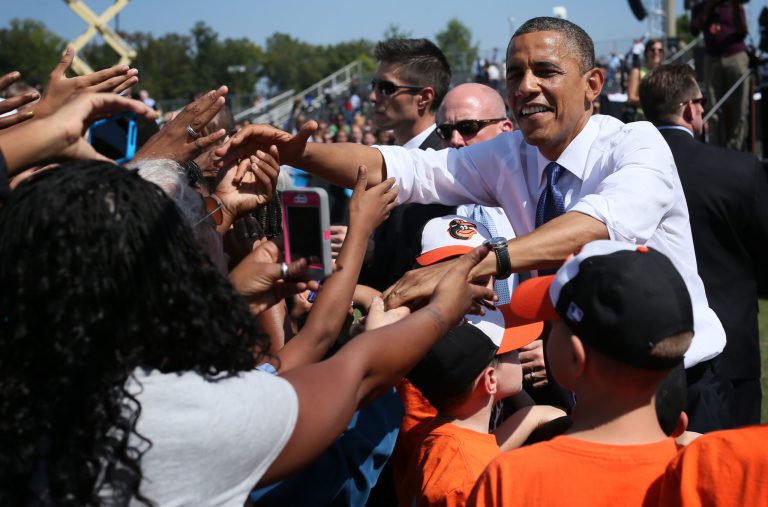 WOODBRIDGE, VA - SEPTEMBER 21:  U.S. President Barack Obama shakes hands with supporters as members of Woodbridge Little League Team look on during a campaign rally September 21, 2012 in Woodbridge, Virginia. Obama spoke on economy as he continues to campaign for a second term in the White House.  (Photo by Alex Wong/Getty Images)