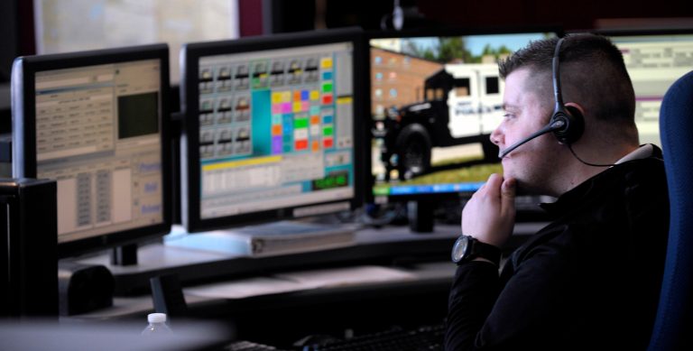 Novi Police 9-1-1 Dispatcher Marc Pieknik dispatches police officers and firefighters to incidents and calls for service from his dispatch station, Thursday, March 6, 2014 in Novi, Mich.  The state is taking over a mid-Michigan police records sharing system that's used in 10 counties and officials plan an expansion that is expected to allow many law enforcement officers across the state to view other agencies' reports from their police vehicles. (AP Photo/Detroit News, Todd McInturf)  DETROIT FREE PRESS OUT; HUFFINGTON POST OUT