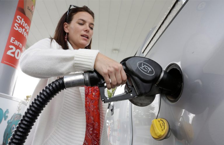 FuelMe, an app available to Texas residents on Apple or Android smartphones, charges a $5 delivery fee plus the price of fuel for its services. (AP Photo)