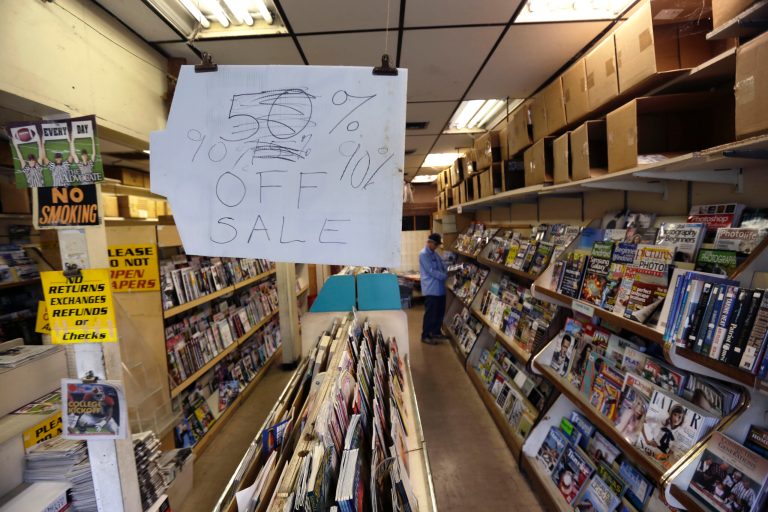 A sale sign hangs at Lakeside News in New Orleans, Wednesday, Sept. 2, 2015. In a sign of the digital times, one of the last newsstands in metro New Orleans, and certainly its most popular, was closing. (AP Photo/Gerald Herbert)