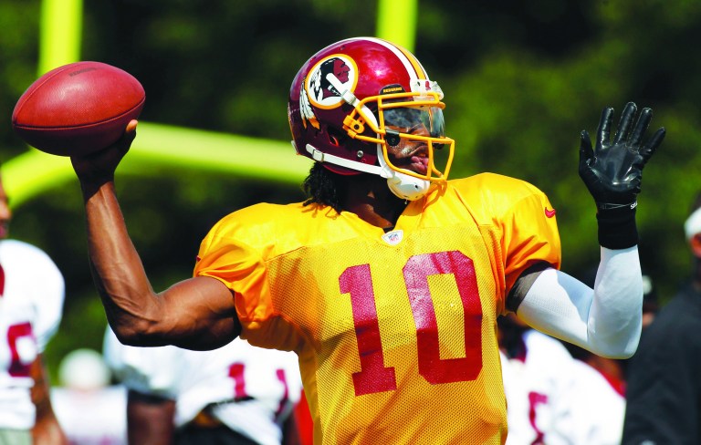 Alex Brandon/AP
Redskins quarterback Robert Griffin III played 14 snaps vs. Buffalo on Thursday and led Washington on its only scoring drive.