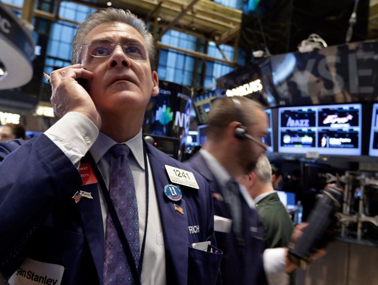 Trader Richard Deviccaro works on the floor of the New York Stock Exchange, Friday, Jan. 17, 2014. (AP Photo/Richard Drew)
