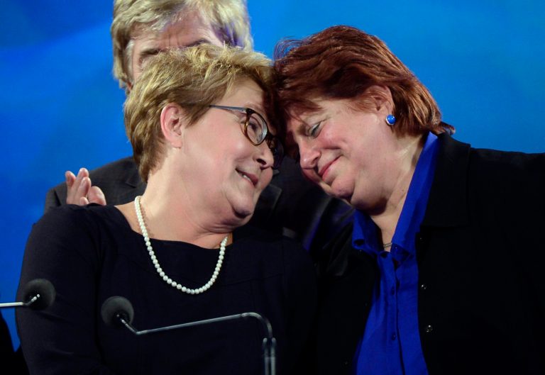 Parti Quebecois leader Pauline Marois is hugged by Nicole Leger after taking the stage following the PQ defeat in the provincial election Monday April 7, 2014 in Montreal. Marois also lost her seat in Charlevoix-Cote-de-Beaupre to Liberal candidate Caroline Simard.  (AP Photo/The Canadian Press, Paul Chiasson)