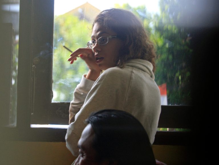 Heather Mack, stands at the police district headquarters after she was brought in for questioning in relation to the death of her mother, in Bali, Indonesia, Thursday, Aug. 14, 2014. The body of Sheila von Wiese-Mack, a 62-year-old American woman, was found stuffed inside a suitcase on the Indonesian resort island of Bali, and authorities on Wednesday arrested her daughter and her daughter's boyfriend in relation to the death, police said. The suitcase containing Mack's body was found Tuesday inside the trunk of a taxi parked in front of the St. Regis Bali Resort in the island's upscale Nusa Dua area, said Col. Djoko Hari Utomo, the police chief in Bali's capital, Denpasar. (AP Photo/Firdia Lisnawati)