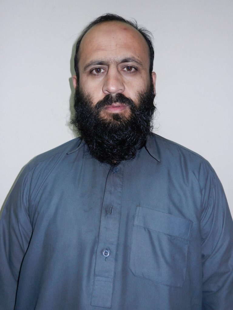 In this Wednesday, Oct. 15, 2014 photo provided by Afghanistan's National Directorate of Security (NDS), Hafiz Rashid, a senior leader of the al-Qaida-linked Haqqani network, poses for a picture in Kabul, Afghanistan. Officials said Rashid, a senior commander of the network, and Anis Haqqani, another senior leader of the network, have been arrested by the Afghan intelligence service NDS in eastern Khost province. (AP Photo/National Directorate of Security)