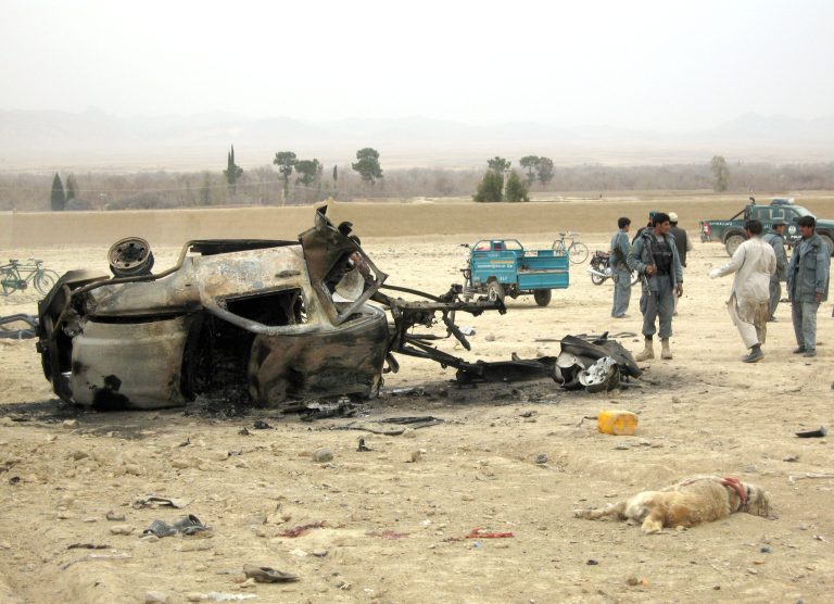 Getty Images
Afghans stand at the site of a blast on February 27, 2011 in Arghandab district of Kandahar province, Afghanistan.  Eight Afghan civilians were killed when two blasts targeted a dog fighting competetion, a practice that was previously banned under Taliban rule.
