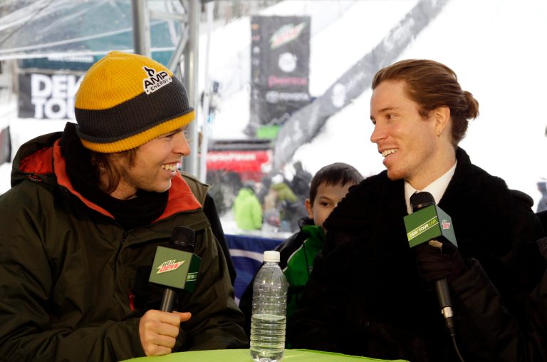   American snowboarders Kevin Pearce, left, and Shaun White joke with each other during a television interview for the Dew Tour at Breckenridge ski resort in Breckenridge, Colo., Friday, Dec. 14, 2012. As he heads into this weekend's Dew Tour iOn Mountain Championship finals, the opening event on the 2012-13 snowboarding calendar, White said there's more to come, with the Sochi Games just a little over a year away. (AP Photo/Brennan Linsley)  