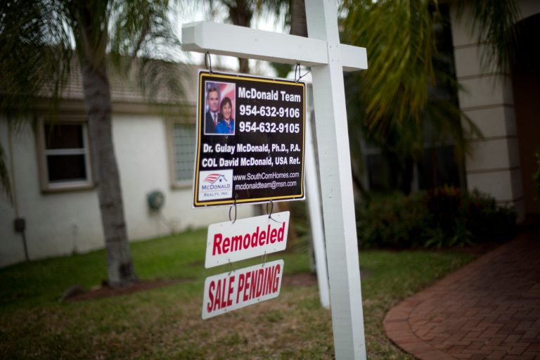 In this March 17, 2014 photo, a for sale sign hangs outside a home in Pembroke Pines, Fla. The National Association of Realtors on Monday, April 28, 2014 said its seasonally adjusted pending home sales index rose 3.4 percent to 97.4 last month. Still, the index remains 7.9 percent below its level a year ago. (AP Photo/J Pat Carter)