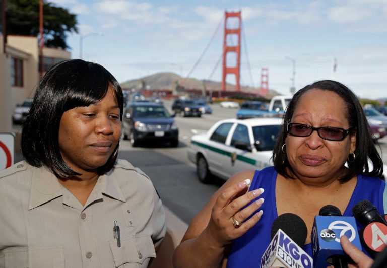 Toll takers Dawnette Reed, left, and Jacquie Dean, right, talk with reporters about their last day on the job at the Golden Gate Bridge Tuesday, March 26, 2013 in San Francisco. The historic bridge will take a high-tech leap forward when it becomes the first California span to replace all human toll takers with an electronic system that ends the need for motorists to stop and pay cash. Toll takers will collect money for the last time early Wednesday before the toll booths are closed for good. (AP Photo/Eric Risberg)