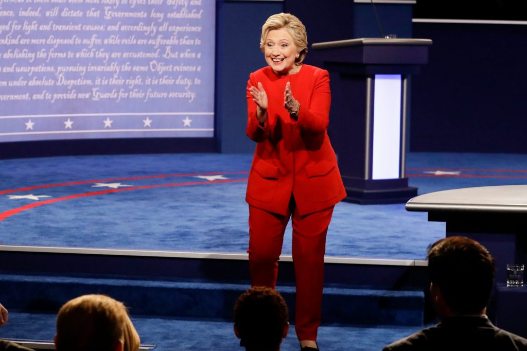 Clinton draws cheers for debate victory lap at rally