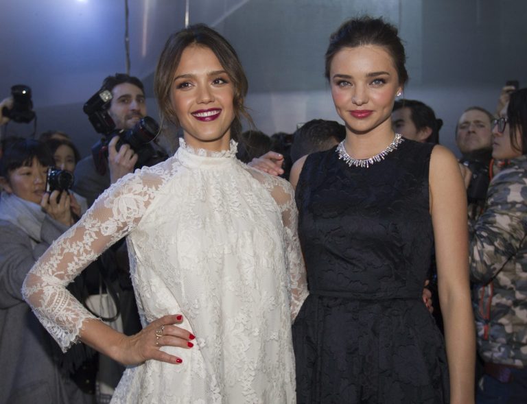 Jessica Alba, left and Miranda Kerr pose prior to the show of H&M's  ready-to-wear fall/winter 2014-2015 fashion collection presented in Paris, Wednesday, Feb. 26, 2014. (AP Photo/Jacques Brinon)