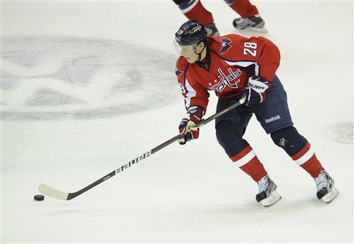 Washington Capitals left wing Alexander Semin (28), of Russia, skates with the puck during the first period of an NHL hockey game against the Toronto Maple Leafs, Friday, Dec. 9, 2011, in Washington.