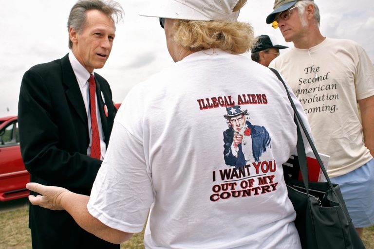 Members of the Minuteman Project speak with then-Rep. Virgil Goode (R-VA) during a 2007 rally on the National Mall. (Getty Images)