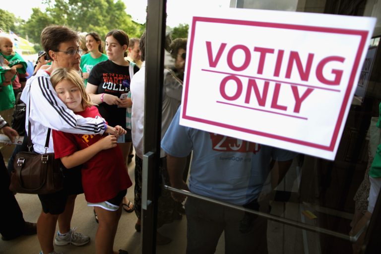 Voters line up outside the Hilton Coliseum to vote in the Iowa Straw Poll at Iowa State University August 13, 2011 in Ames, Iowa. (Photo by Chip Somodevilla/Getty images)
