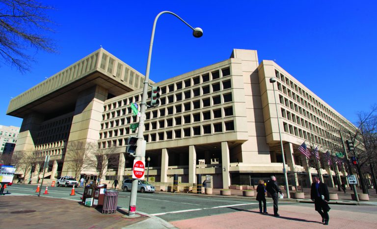 FILE - This Feb. 3, 2012 file photo shows the Federal Bureau of Investigation (FBI) headquarters in Washington. Trying to ratchet up pressure on Congress, the White House on Friday detailed what it said would be the painful impact on the federal work force and certain government assistance programs if 