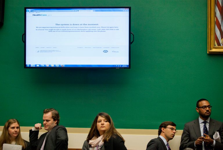 A screen shows the Healthcare.gov website being down during a House Energy and Commerce Committee hearing on Capitol Hill in Washington, Oct. 30.  (AP Photo/ Evan Vucci)