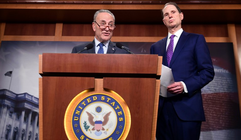 Senate Minority Leader Sen. Chuck Schumer of N.Y., left, standing with Sen. Ron Wyden, D-Ore., right, speaks on Capitol Hill in Washington, Thursday, Nov. 9, 2017, about the Republican tax reform plan. (AP Photo/Susan Walsh)