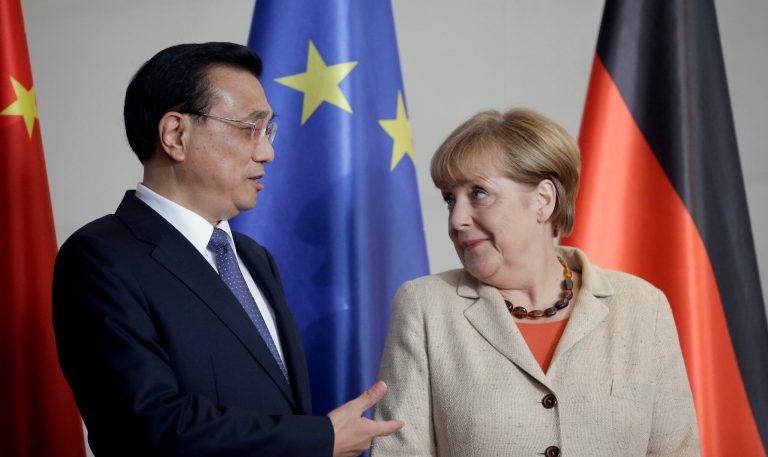 German Chancellor Angela Merkel, right, and the Prime Minister of China, Li Keqiang, left, talk during a contract signing ceremony as part of a meeting of the German and Chinese government at the chancellery in Berlin, Germany, Friday, Oct. 10, 2014. Economic ties between Germany and China are the focus of the high-level meeting between the two countries' governments.  (AP Photo/Michael Sohn)
