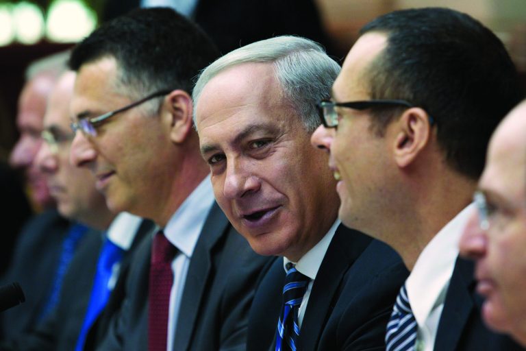 Israeli Prime Minister Benjamin Netanyahu, center, chairs the weekly cabinet meeting in his Jerusalem offices, Sunday, Oct. 14, 2012. Israel's Cabinet has announced January 22, 2013 as the date for parliamentary elections, with Prime Minister Benjamin Netanyahu leading in the polls. (AP Photo/Jim Hollander, Pool)