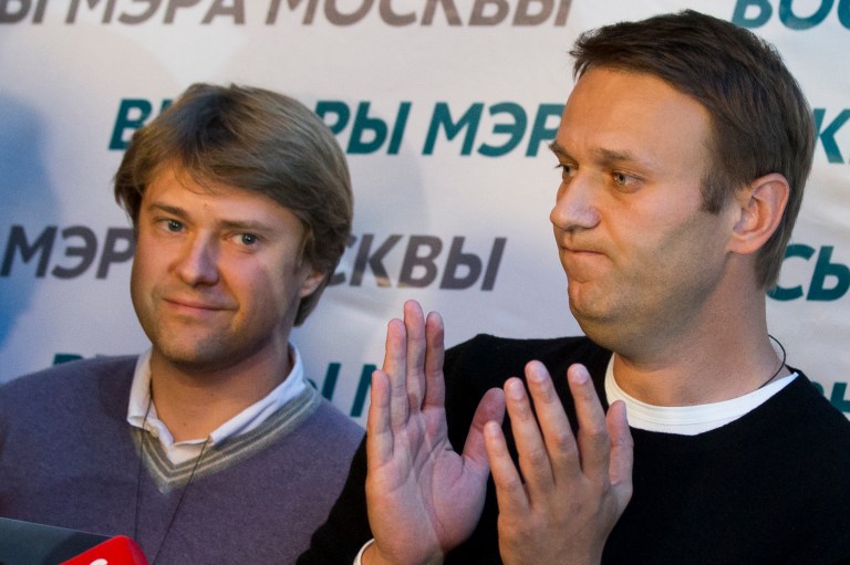 In this photo taken on Sunday, Sept. 8, 2013, Vladimir Ashurkov, left, a top aide of top Russian opposition leader and anti-corruption blogger Alexei Navalny, right, who has been under house arrest since February 2014, attends a news conference at his headquarters in Moscow, Russia. Vladimir Ashurkov wrote on Twitter Monday that he had requested asylum in the United Kigdom 