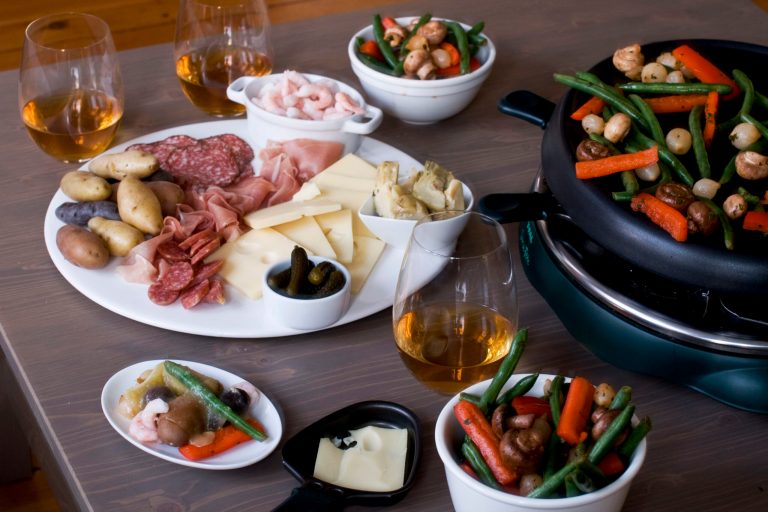   In this image taken on December 3, 2012, New Year's Eve raclette is shown served on a table in Concord, N.H. (AP Photo/Matthew Mead)  