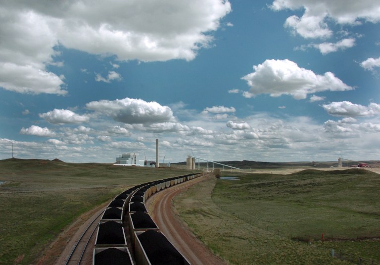   FILE - In this Thursday, April 29, 2010 file photo, a pair of coal trains idle on the tracks near Dry Fork Station, a coal-fired power plant being built by the Basin Electric Power Cooperative near Gillette, Wyo. The share of U.S. electricity that comes from coal has fallen to its lowest level since World War II. Utilities are aggressively ditching coal in favor of natural gas, which has become cheaper and produces far fewer emissions of toxic chemicals and gases that contribute to climate change.(AP Photo/Matthew Brown)  