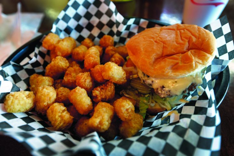 This Wednesday, Feb. 6, 2013 photo shows a hamburger and tater tots at a restaurant in Charlotte, N.C. Deep-fried foods may be causing trouble in the Deep South. People whose diets are heavy on them and sugary drinks were more likely to suffer a stroke, according to a new study released Thursday, Feb. 7, 2013. (AP Photo/Chuck Burton)