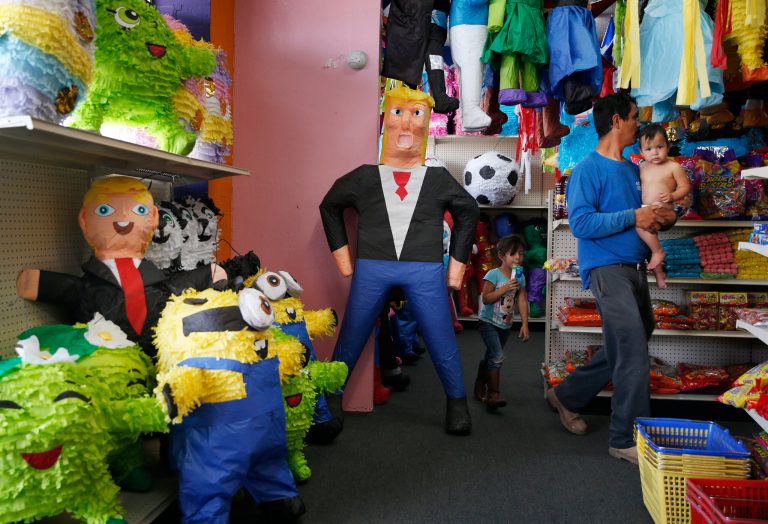 Trump takes a swing at Obmacare. (AP Photo/John Locher)