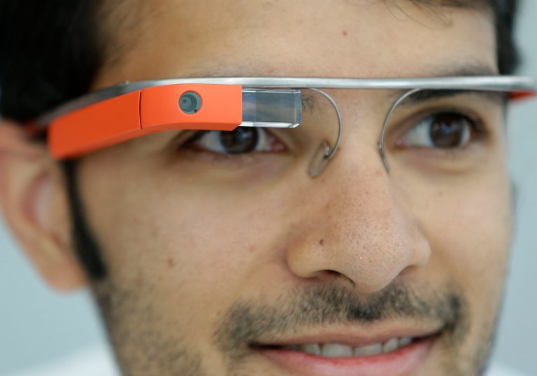 FILE - This May 15, 2013 file shows Google Glasses displayed in San Francisco. Google has a challenge for U.S. nonprofits. On Tuesday, the tech giant is asking nonprofit groups to propose ideas for how to use the Web-connected eyewear Google Glass in their work. Five charities that propose the best ideas by May 20 will get a free pair of the glasses, a trip to Google for training and a $25,000 grant to help make their project a reality.  (AP Photo/Jeff Chiu, File)