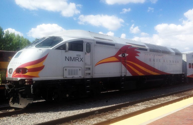 This Wednesday, Aug. 13, 2014 photo, the Rail Runner Express locomotive stands at the depot in Santa Fe, N.M. New Mexico has paid nearly $8 million to settle damage claims against  the state-owned commuter rail system, since it began operating in 2006, according to General Service Department records. The payments include about $4 million for wrongful death claims for car-train accidents in Valencia County, N.M. that killed three people in 2007.  (AP Photo/Barry Massey)