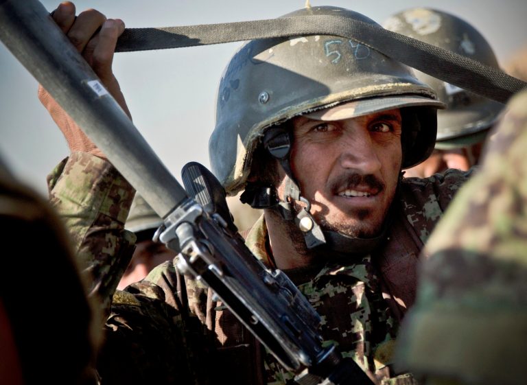 An Afghan soldier adjusts his weapon sling during a practice session at a training facility on the outskirts of Kabul, Afghanistan, on Nov. 26. (AP Photo/Anja Niedringhaus)