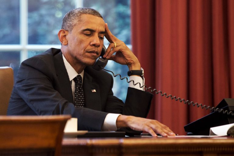 President Barack Obama listens during a phone call with Jordan's King Abdullah II Jordan, according to the White House, Friday, Aug. 8, 2014, in the Oval Office of the White House in Washington. (AP Photo/Jacquelyn Martin)