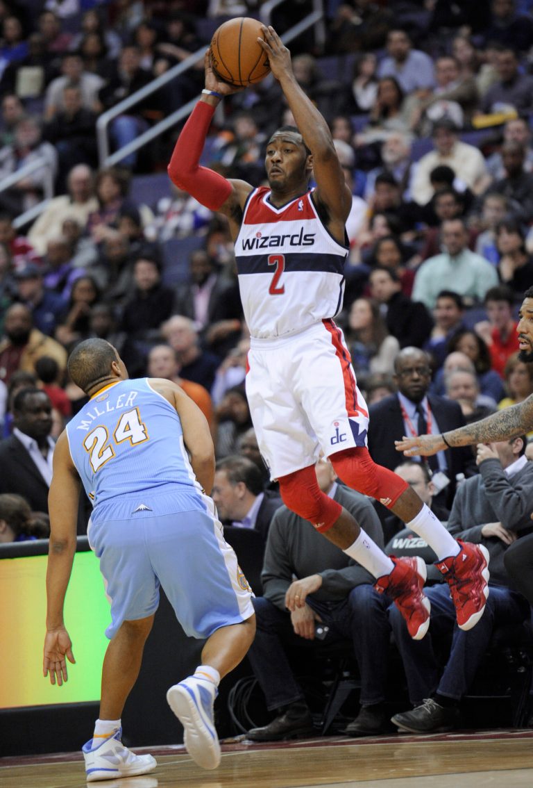 Nick Wass/AP
Washington guard John Wall had 14 points, 10 assists and three blocks as the Wizards beat the Nuggets 119-113 on Friday at Verizon Center.
