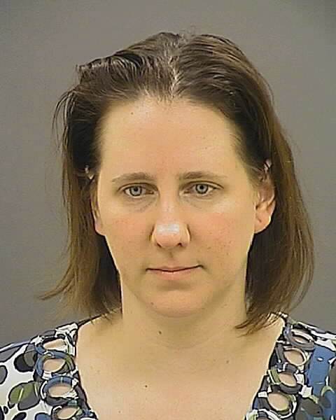 This photo provided by the Baltimore Police, Lynette Trotta of Parkville, Md. is shown. Baltimore police say Trotta, a teacher at a Catholic high school has been charged with engaging in sexual activity with a student.  Trotta is a science teacher at Archbishop Curley High School. The school said in a statement posted on its website that she had been suspended. According to a statement of probably cause, Trotta began showing an interest in the male student last year. The document says Trotta would and the student would engage in sexual activity in her classroom during school hours. The statement also says Trotta and the student engaged in sexual activity in Trotta's car.  (AP Photo/Baltimore Police)