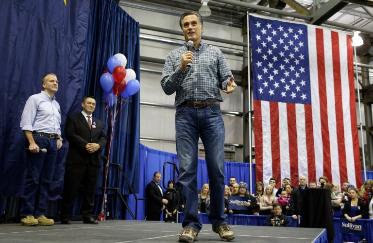 Former Republican presidential candidate Mitt Romney, center, speaks at a Dan Sullivan campaign rally, Monday, Nov. 3, 2014, in an airplane hanger in Anchorage, Alaska. (AP Photo/Ted S. Warren)