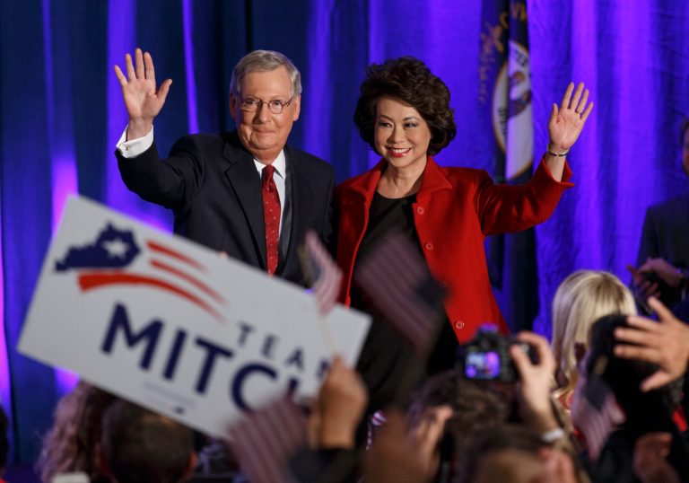 Senate Minority Leader Mitch McConnell of Ky., joined by his wife, former Labor Secretary Elaine Chao, celebrates with his supporters at an election night party in Louisville, Ky.,Tuesday, Nov. 4, 2014. McConnell won a sixth term in Washington, with his eyes on the larger prize of GOP control of the Senate. The Kentucky Senate race, with McConnell, a 30-year incumbent, fighting off a spirited challenge from Democrat Alison Lundergan Grimes, has been among the most combative and closely watched contests that could determine the balance of power in Congress. (AP Photo/J. Scott Applewhite)