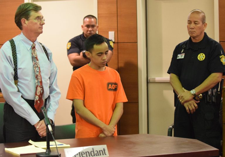 Chad DeSoto, in orange, showed no outward emotion as he is handed down three life sentences without the possibility of parole at the Superior Court of Guam in Hagatna, Guam, on Sept. 25, 2014. DeSoto was convicted last month in the slaying of three Japanese tourists and attacks on 11 other people in Tumon, Guam, on Feb. 12, 2013. (AP Photo/The Pacific Daily, Mark Scott)
