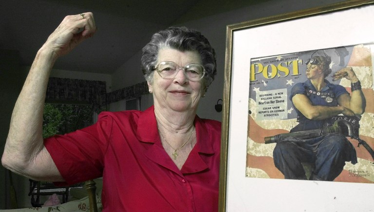 Mary Doyle Keefe poses at her home in Nashua, N.H., with the May 29, 1943, cover of the Saturday Evening Post for which she had modeled as 
