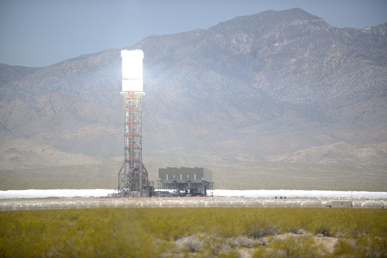 The plant uses thousands of mirrors on 3,500 acres in the Mojave desert to direct concentrated sunlight at three towers. (Image courtesy Wikipedia user Aioannides)