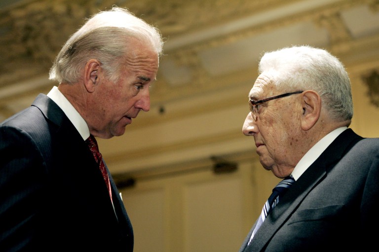 FILE - In this May 1, 2006, file photo, then-Sen. Joseph Biden, D-Del., left, speaks with  former Secretary of State Henry Kissinger, after he gave a speech proposing that Iraq be divided into three separate regions during the  World Affairs Council of Philadelphia conference in Philadelphia. As Iraq edges toward chaos, Vice President Joe Biden is having a quiet I-told-you-so moment. As a senator in 2006, Biden proposed that Iraq be divided into three semi-independent regions for Shiites, Sunnis and Kurds. And he said that his plan would allow U.S. troops to be out by early 2008. Otherwise, he warned, Iraq could fall into sectarian conflict that could destabilize the region.  (AP Photo/Matt Rourke, File)