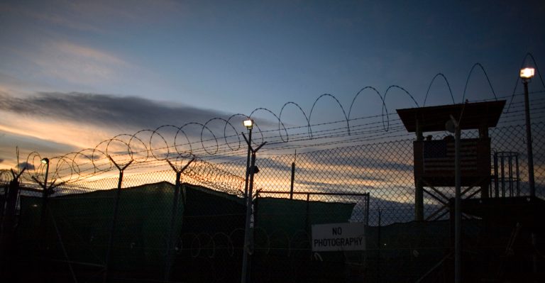 In this file image reviewed by the U.S. Military, the sun rises over Guantanamo detention facility, at the U.S. Naval Base, in Guantanamo Bay, Cuba, Nov. 19, 2008. The White House acknowledged for the first time Sept. 25, 2009 that it might not be able to close the U.S. military prison at Guantanamo Bay by January as President Obama has promised. (AP Photo/Brennan Linsley, File)